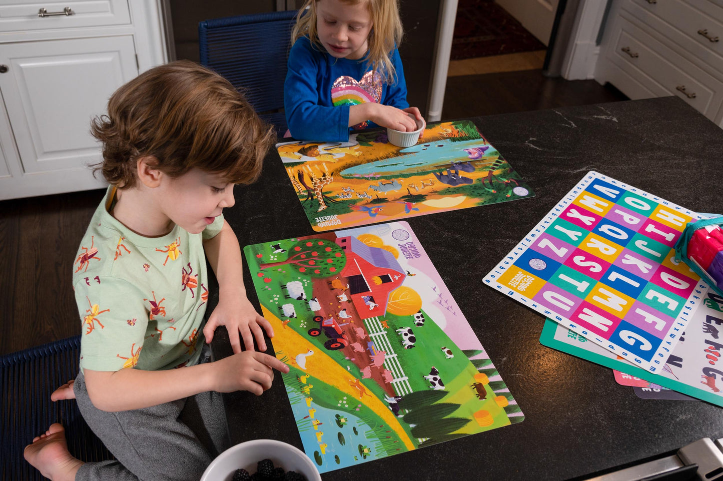 Kids Learning Placemats: Farm, Safari, Sea, Woods Activity Mats. Children playing with Domino Julette placemats.