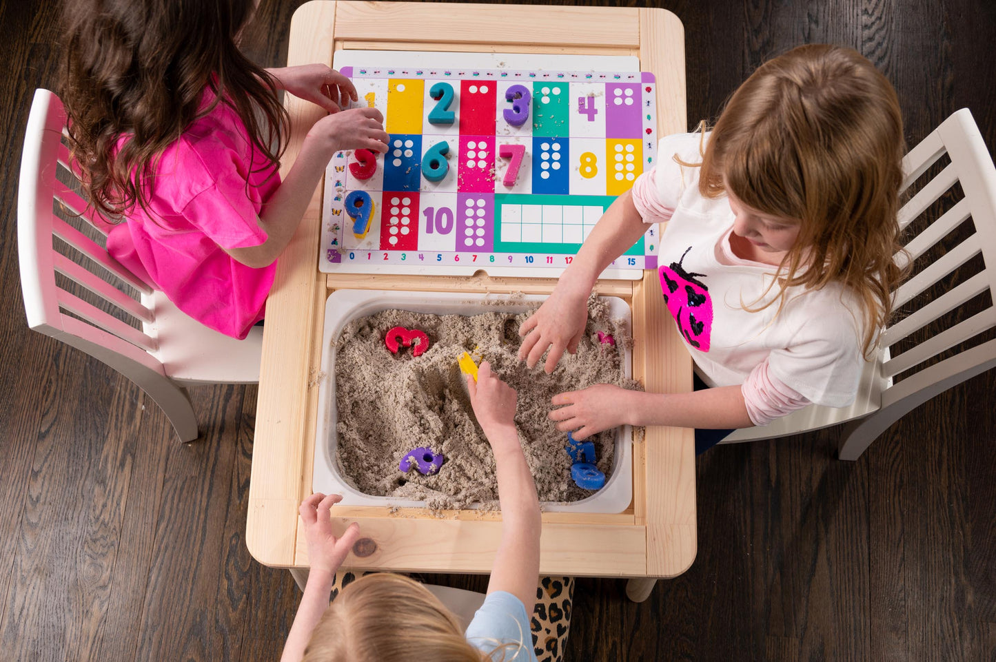 Kids playing with number & shapes puzzle: Educational toy for learning numbers, colors, and sensory play.