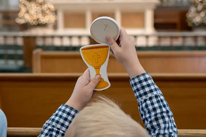 Child playing with Quiet Mass Set from Puzzle Planet - Catholic toy for sensory play and learning about Church service in Church. 
