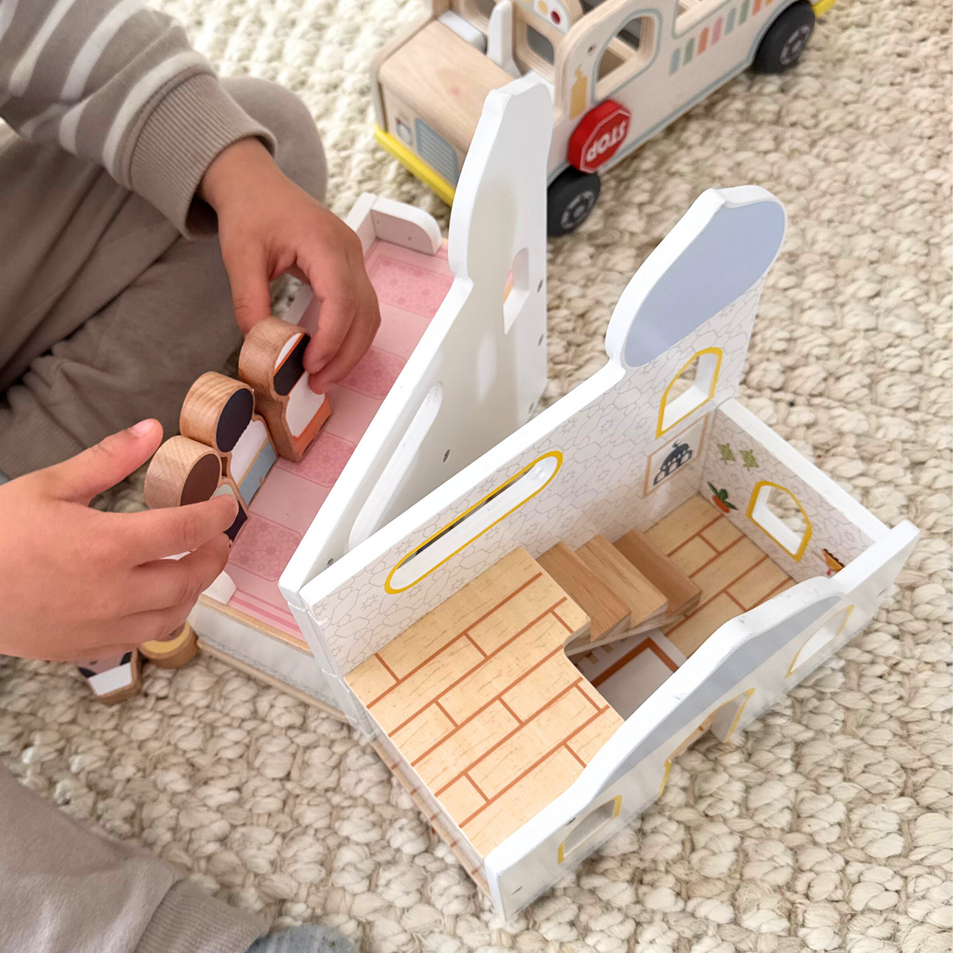 Child playing with Masjid Playhouse from Puzzle Planet - Islamic wooden toy for kids, mosque dollhouse, educational play